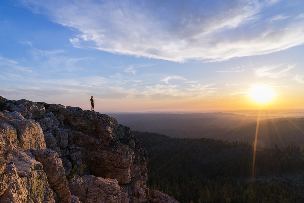 Man on mountain at sunset