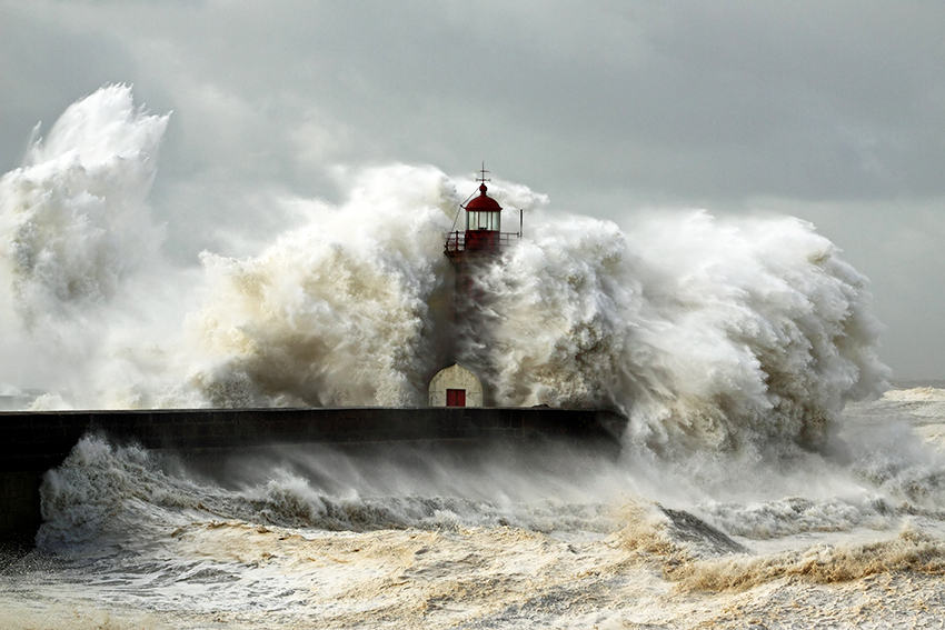 Lighthouse and crashing waves